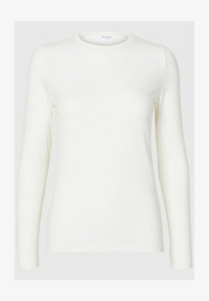 Pitkähiha valkoinen paita, joka on valmistettu pehmeästä kankaasta. Paidan kauluksessa on pyöreä pääntie, ja se on sileä tekstuuriltaan sekä kapea muotoilultaan. Ei näkyviä kuvioita tai koristeita.