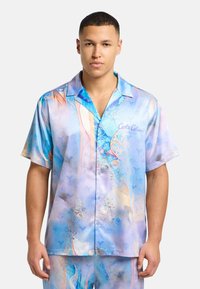 Short-sleeve button-up shirt in light blue satin with abstract swirl patterns, featuring a camp collar and subtle graphic details.