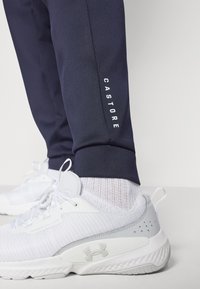 Castore SCUBA JOGGERS - Tracksuit bottoms - midnight navy