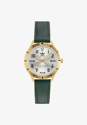 Goldfarbene analoge Uhr mit silbernem Zifferblatt, grünem Lederarmband und schwarzen Stundenmarkierungen. Verfügt über eine strukturierte Lünette und das Markenlogo.