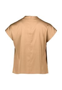 Blusa beige a maniche corte in tessuto liscio, con zip sul retro e vestibilità rilassata, caratterizzata da un collo alto e linee pulite.