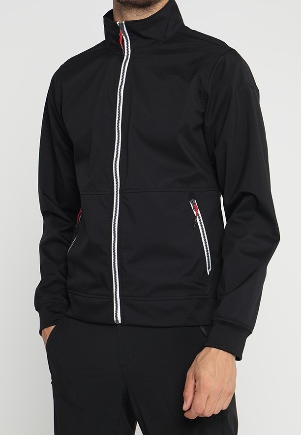 Veste noire avec fermeture éclair à l'avant, col montant et accents blancs. Comprend deux poches latérales zippées et une coupe ajustée. Texture lisse.