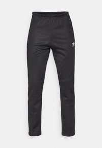 Černé sportovní kalhoty s elastickým pasem, s bílým logem Adidas a detaily bočního pruhu. Vyrobeno z hladkého, elastického materiálu.