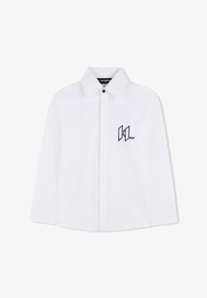 Chemise blanche à boutons en tissu net, avec un col pointu et des manches longues. Logo "KL" noir brodé sur le côté gauche de la poitrine.