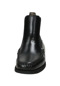 Stivaletti neri in pelle con finitura liscia, punta arrotondata e cuciture decorative lungo il bordo. Design senza lacci con linguetta per facilitare l'indosso.