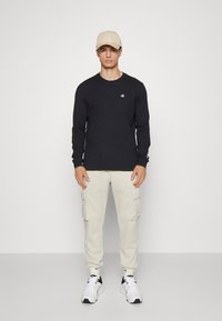 Champion LONG SLEEVE - Top s dlhým rukávom - black