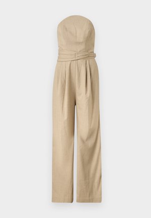 Világosbarna, vállpánt nélküli, bőszárú overál, testhezálló felsőrésszel és övvel a deréknál, könnyű anyagból készült.