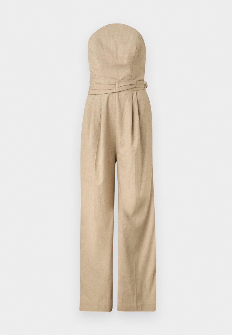 Μπεζ ολόσωμη φόρμα χωρίς τιράντες με φαρδύ πόδι, εφαρμοστή κορυφή και ζώνη στη μέση, κατασκευασμένη από ελαφρύ ύφασμα.