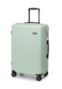 Valigia rigida di colore verde menta chiaro, con scanalature verticali, manico telescopico e quattro ruote nere per la mobilità.