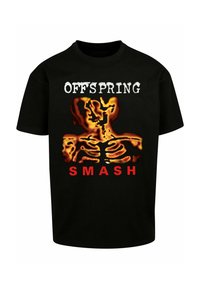 T-shirt en coton noir avec un design graphique représentant des mains en squelette de couleur flamme et un texte blanc indiquant "OFFSPRING" et "SMASH" en rouge.