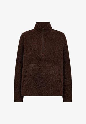 Tumma ruskea fleece-pullove, jossa on pitkät hihat, pystykollla, puolivälin vetoketju ja kaksi vetoketjullista taskua.