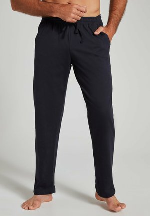 Pantalones de chándal azul marino con cinturilla ajustable, bolsillos laterales, piernas rectas y textura suave. Adecuados para un uso casual en casa.