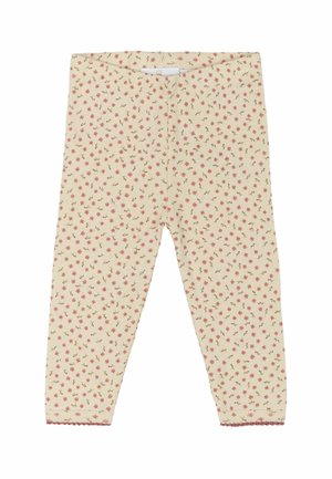 Leggingit vaalean kermanväriset, joissa on pinkki- ja vihreäkasvi-kuvio, ruostevallapinta ja aaltoilevat helmat nilkoissa.