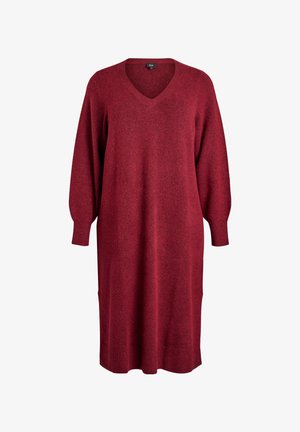 Abito rosso a maglia con scollo a V, maniche lunghe a sbuffo e silhouette dritta. Texture morbida e dettagli con polsini e orlo a coste.