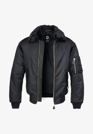 Giubbotto bomber nero con colletto in pelliccia sintetica, con zip dorata, polsini elastici e una tasca utility sulla manica. Finitura del tessuto liscia e lucida.