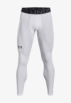 White athletic leggings featuring a fitted design, elastic waistband with black logo, and smooth texture. Suitable for activewear purposes.