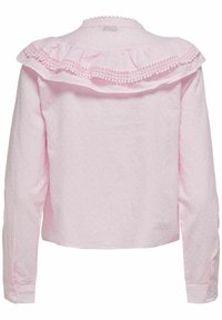 Blusa rosa a maniche lunghe con un motivo di pois testurizzati, scollo arricciato e dettagli di rifinitura delicati. Polsi bottonati e design corto.