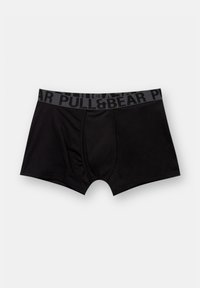Zwarte katoenen boxershorts met een zwarte elastische tailleband waarop de merknaam "PULL&BEAR" in contrasterende grijze tekst staat.