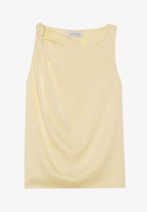 Sleeveless yellow top with a textured finish and a gathered side detail. Soft fabric and a relaxed fit, featuring a straight hem.