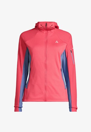 Czerwona i niebieska kurtka zapinana na zamek z kapturem, z ryflowanym wzorem na ramionach, bocznymi kieszeniami i elastycznymi mankietami. Podkreślona kieszenią na rękawie zapinaną na zamek.