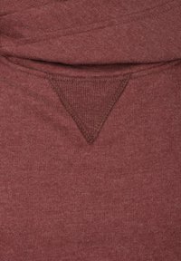 Maroon cotton fabric with a textured, triangular detail at the back. Soft, smooth finish. Casual design with no visible patterns or hardware.