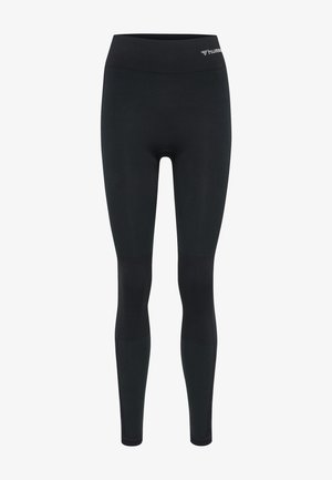 Black leggings made from stretchy fabric. Features a high waistband and textured panels on the lower legs. Simple design with logo detail.