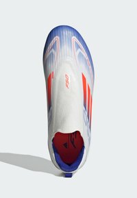 F50 football boot with a white upper, blue gradient, and red accents. Features sock-like design, textured material, and rear pull tab.