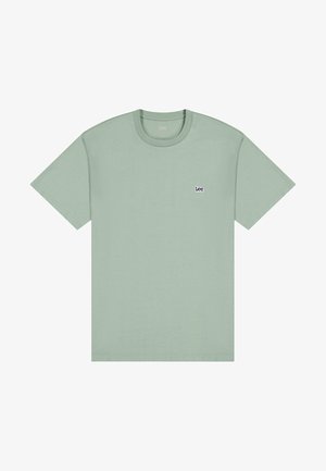 Light green cotton t-shirt with short sleeves, round neckline, and a small navy logo on the left chest. Smooth texture, regular fit.