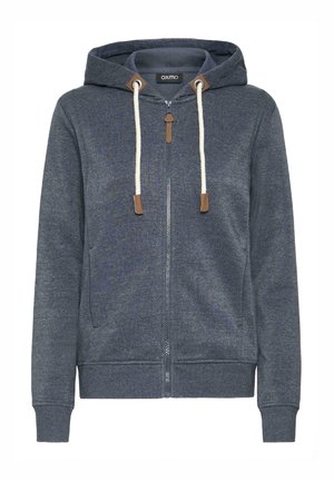 Tumši zilas krēms ar kapuci, izgatavots no mīksta kokvilnas maisījuma. Aprīkots ar auklām, ādas akcentiem un ribinātiem piedurkņu galiem un apakša.