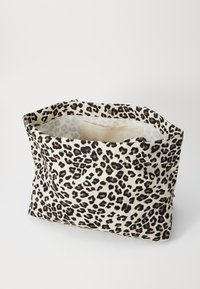Leopard print fabric bag with an open top, featuring a beige interior and a subtle snap closure. Soft texture, rectangular shape.