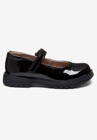 Black patent leather Mary Jane shoe with rounded toe, adjustable strap, cushioned insole, and textured rubber sole for grip.