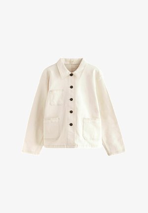 Heledbeez denim jakk koos terava kraega, nupuliselt esiküljelt kinnituv ja kahe esiküljepocketiga. Omab monokroomset tikandit ja tumedaid nuppe.