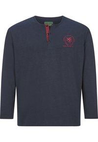 Navy long-sleeve shirt in cotton with a henley neckline, red accent placket, and embroidered logo design on the chest.
