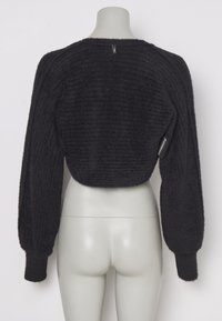 Black cropped sweater with textured, ribbed fabric. Features puffed long sleeves and a round neckline, seen from the back.