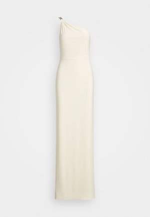 One-shoulder cream dress with draped fabric, slim fit, floor-length design, and a small metallic accent on the shoulder. Smooth texture.