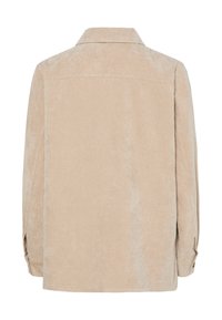 Beige värinen corduroy-takki, jossa on kaulus, pitkät hihat ja napitus hihansuissa. Karkeapintainen, ribbikuvioitu kangas, suora leikkaus ja takasauma.