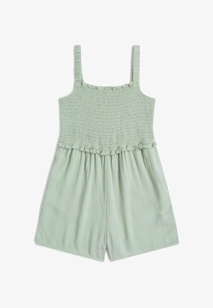 Svetlozelený overal so stiahnutou hornou časťou, tenkými ramienkami a volánovým detailom v oblasti pása. Textúrovaná látka s voľnými krátkymi nohavicami.