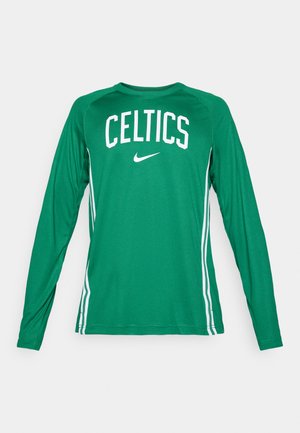 Roheline pikkade varrukatega särk, millel on valge kirjaga "CELTICS" ja Nike logo. Külgedel on kontrastsed valged triibud. Valmistatud kerge kangaga.