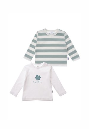 Two long-sleeve baby tops: one white with green four-leaf clover design, the other striped in pale green and white. Soft cotton material.