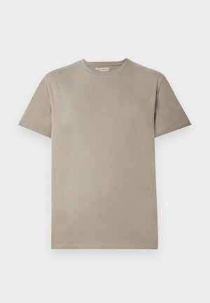 T-shirt à manches courtes en coton beige clair, avec un col rond, un design simple et une texture lisse sans motifs ni accents visibles.
