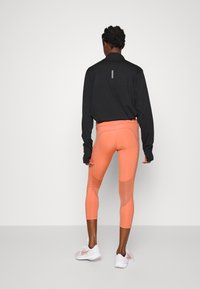 Nike Performance FAST CROP - Leggings - madder root/silver