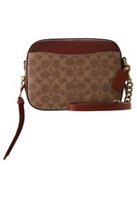 Ruskea Coach olkalaukku, jossa on ikoninen monogrammikuosi, nahkasisustukset, kullanväriset metalliosat ja irrotettava hihna.