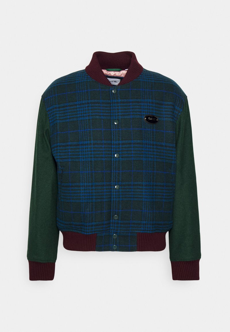Veste bomber en laine boutonnée avec un devant en tartan bleu et vert, des manches unies vert foncé, et un col, des poignets et un ourlet en bord-côtes bordeaux.