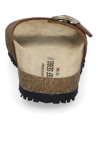 Brown sandal with a textured leather upper, cork footbed, and rubber outsole. Features a metal buckle accent.