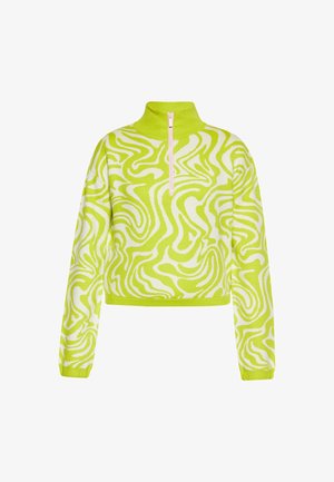 Lyhyt pullover-neule kirkkaan limevihreänä, valkoisilla kiemurakuviolla, korkealla kauluksella ja puoliveto-etupäällä. Pehmeä neulekangas.