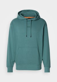 Sweat à capuche vert sarcelle avec poche avant, poignets et base côtelés, cordons à la capuche et logo discret "BOSS" sur la poitrine.