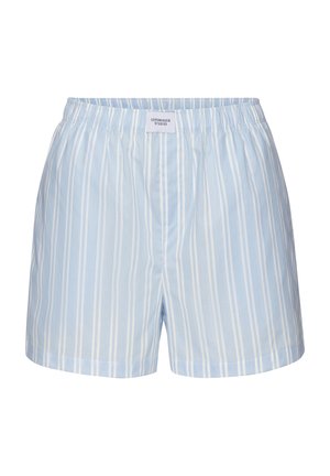 Light blue boxer shorts with vertical white stripes and an elastic waistband with a Copenhagen Studios label at the center front.