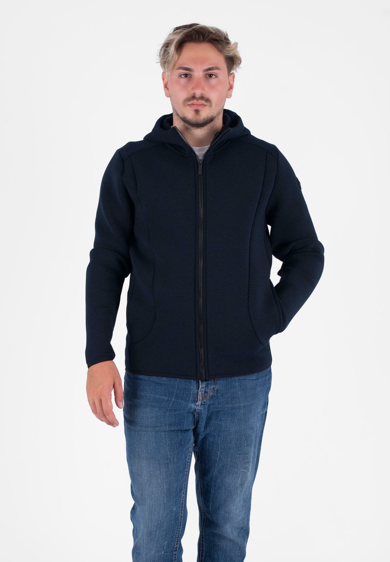 Felpa con zip della marina, realizzata in tessuto liscio, con cappuccio, maniche lunghe, tasche laterali e un design aderente con zip a contrasto.