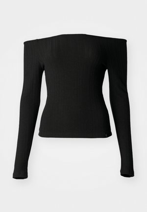 Black long-sleeve top made of ribbed fabric with an off-the-shoulder neckline, fitted design, and a straight hem. Subtle brand tag at the bottom.