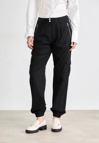 Tommy Jeans MR PANT - Oldalzsebes nadrágok - black